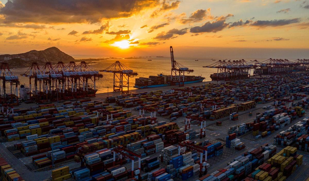 <i>Costfoto/Barcroft Media/Getty Images</i><br/>Cargo ships loading exhibits for the China International Import Expo are seen at the container terminal of Shanghai Yangshan Deep Water Port in Shanghai