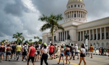 Cubans march in front of Havana's Capitol during a demonstration against the government of Cuban President Miguel Diaz-Canel in Havana