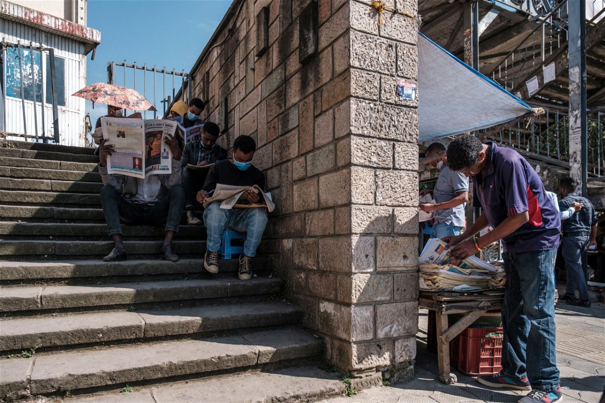 <i>Eduardo Soteras/AFP/Getty Images</i><br/>People read local newspapers in a downtown area of the city of Addis Ababa