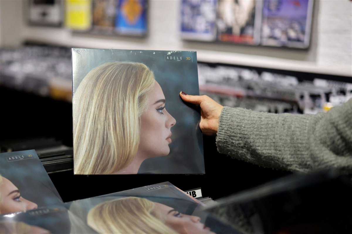 <i>Tolga Akmen/AFP/Getty Images</i><br/>A member of staff sorts copies of Adele's new album 