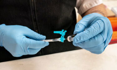 A firefighter prepares pediatric doses of the Pfizer-BioNtech Covid-19 vaccine on November 3 in Shoreline