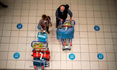 People wait at OR Tambo's airport in Johannesburg