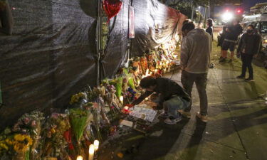 Nike has postponed the release of its latest sneaker collaboration with Travis Scott following the Astroworld concert tragedy that left 10 people dead. People attend a makeshift memorial on November 7