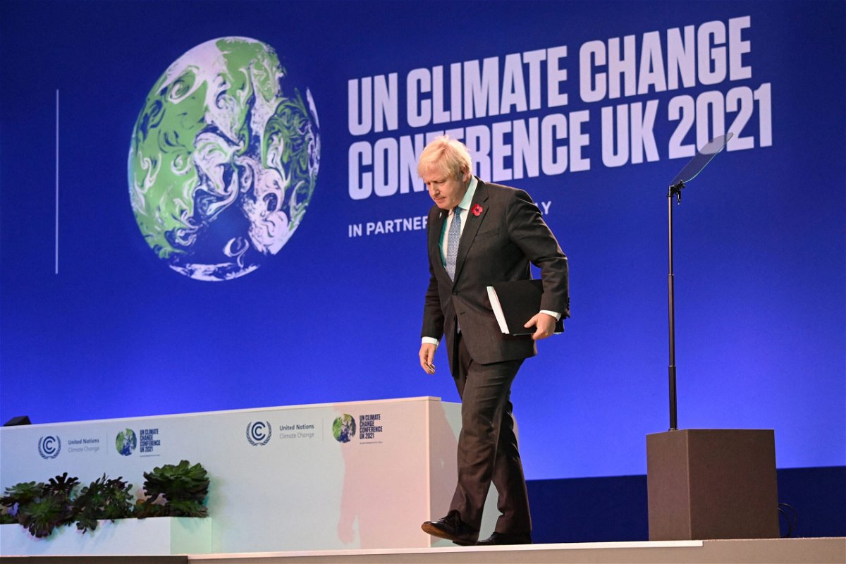 <i>Jeff J Mitchell/Pool/AFP/Getty Images</i><br/>Britain's Prime Minister Boris Johnson walks off of the stage after speaking at COP26 on Monday.