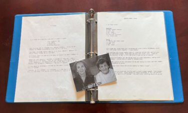 A picture of Michelle Watts and her mother Jessie Monis lays on top of a handmade cookbook that Monis made for her children in 1987.