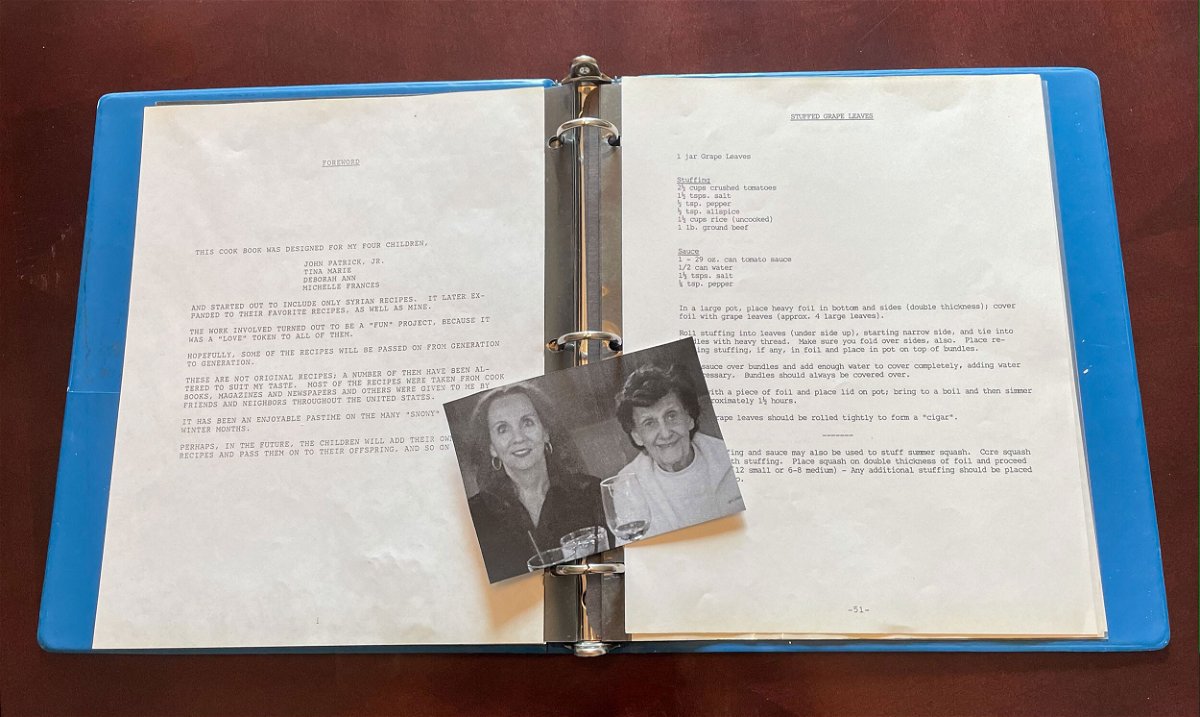 <i>Courtesy Michelle Watts</i><br/>A picture of Michelle Watts and her mother Jessie Monis lays on top of a handmade cookbook that Monis made for her children in 1987.