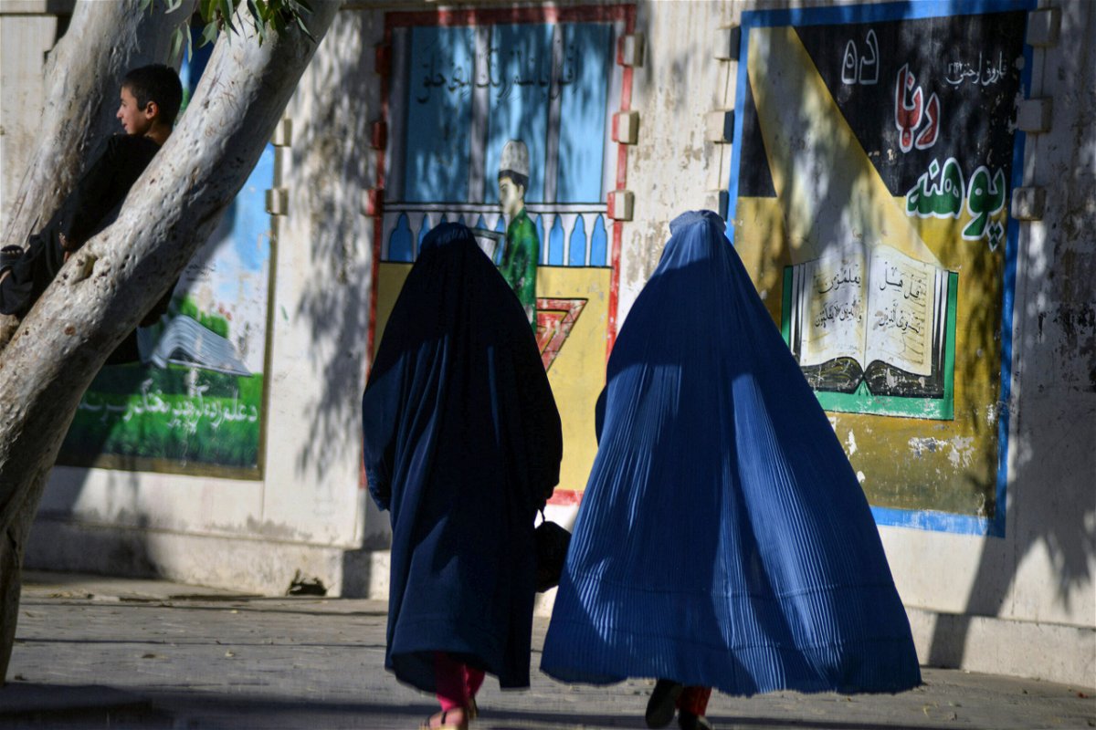 <i>Javed Tanveer/AFP/Getty Images</i><br/>Women will be barred from appearing in television dramas in Afghanistan under the Taliban's new media restrictions. Women are shown here walking along a street in Kandahar on November 13