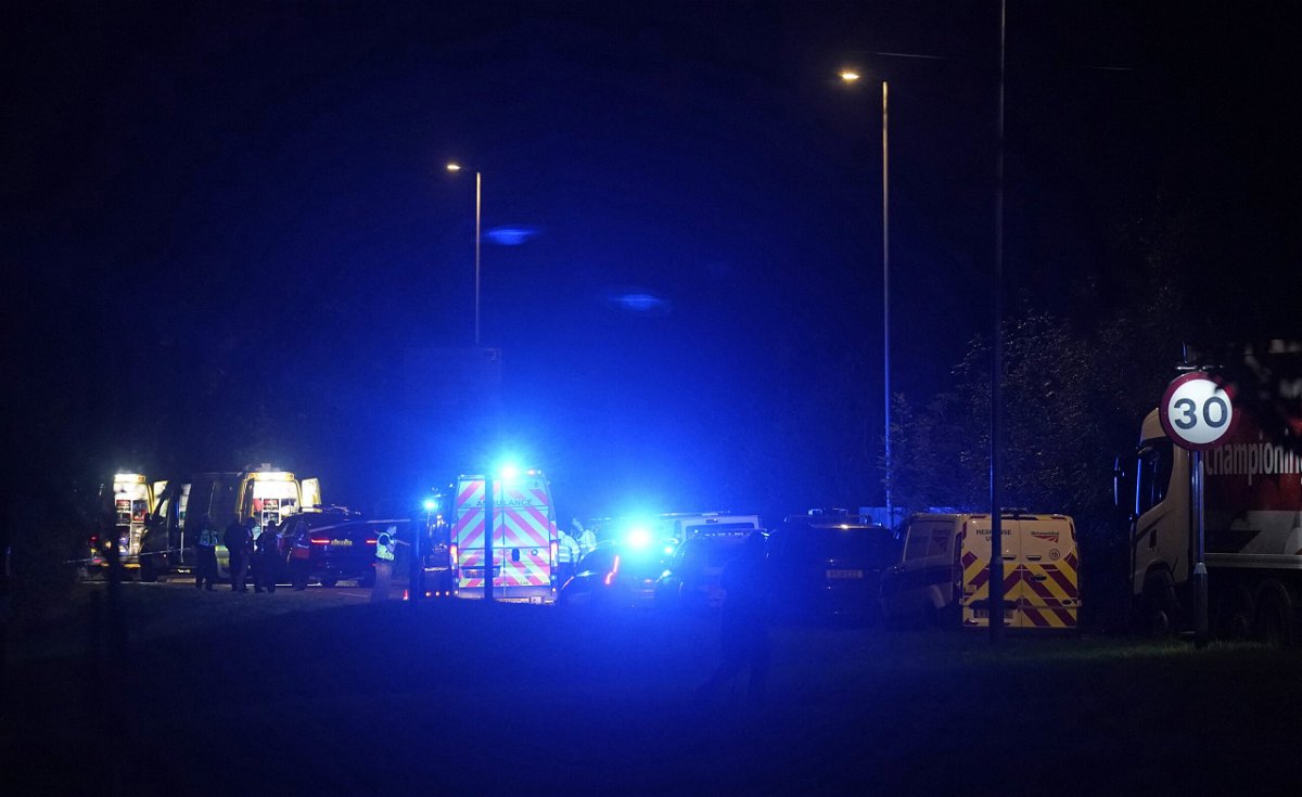 <i>Andrew Matthews/PA Images/Getty Images</i><br/>Emergency services near the scene of a train crash in Salisbury.