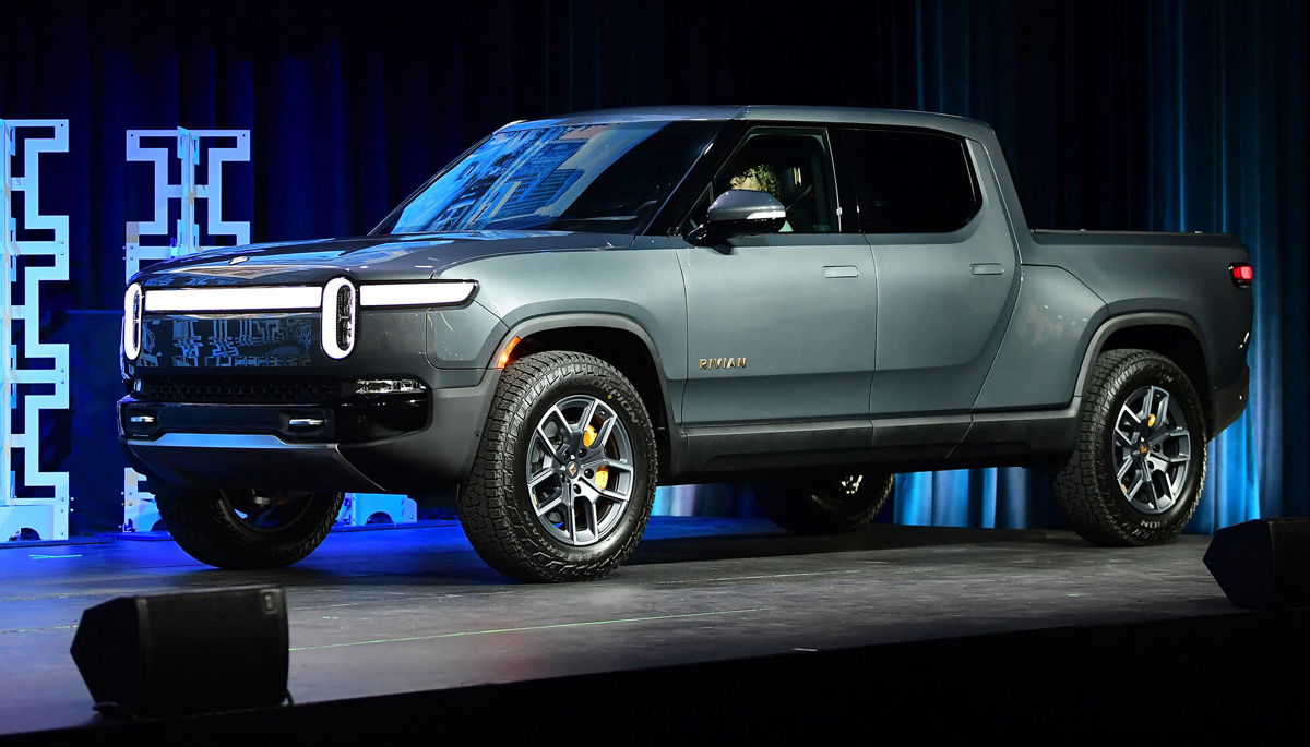 <i>Frederic J. Brown/AFP/Getty Images</i><br/>The Rivian R1T arrives on stage as a 2022 Truck of the Year Finalist at the LA Auto Show in Los Angeles