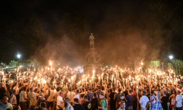 White nationalists participate in a march on the grounds of the University of Virginia ahead of the Unite the Right Rally in Charlottesville