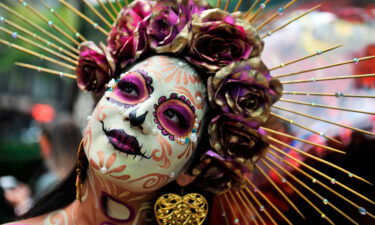 A woman is seen dressed as Catrina takes part in the "Catrinas Parade" celebrating the Day of the Dead in Mexico City in October 2019.