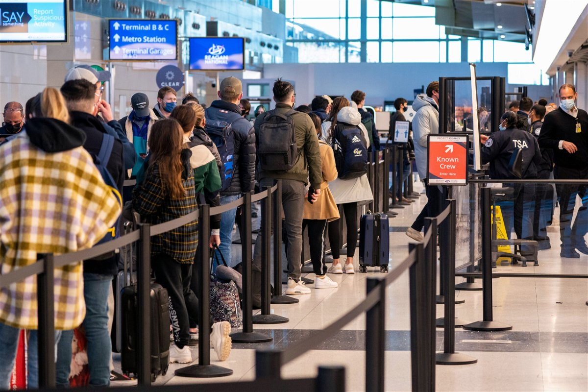 <i>Shawn Thew/EPA-EFE/Shutterstock</i><br/>Experts say the Omicron variant of Covid-19 is raising the concerns of health officials amid the busy holiday travel season