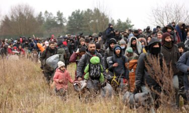People gather near the Belarusian - Polish border crossing in Kuznica on November 15