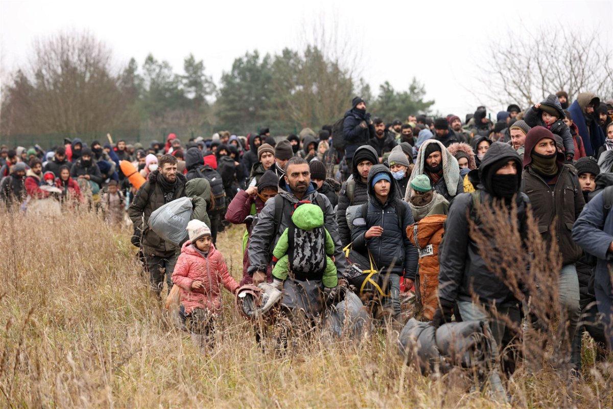 <i>Oksana Manchuk/Belta/AFP/Getty Images</i><br/>People gather near the Belarusian - Polish border crossing in Kuznica on November 15