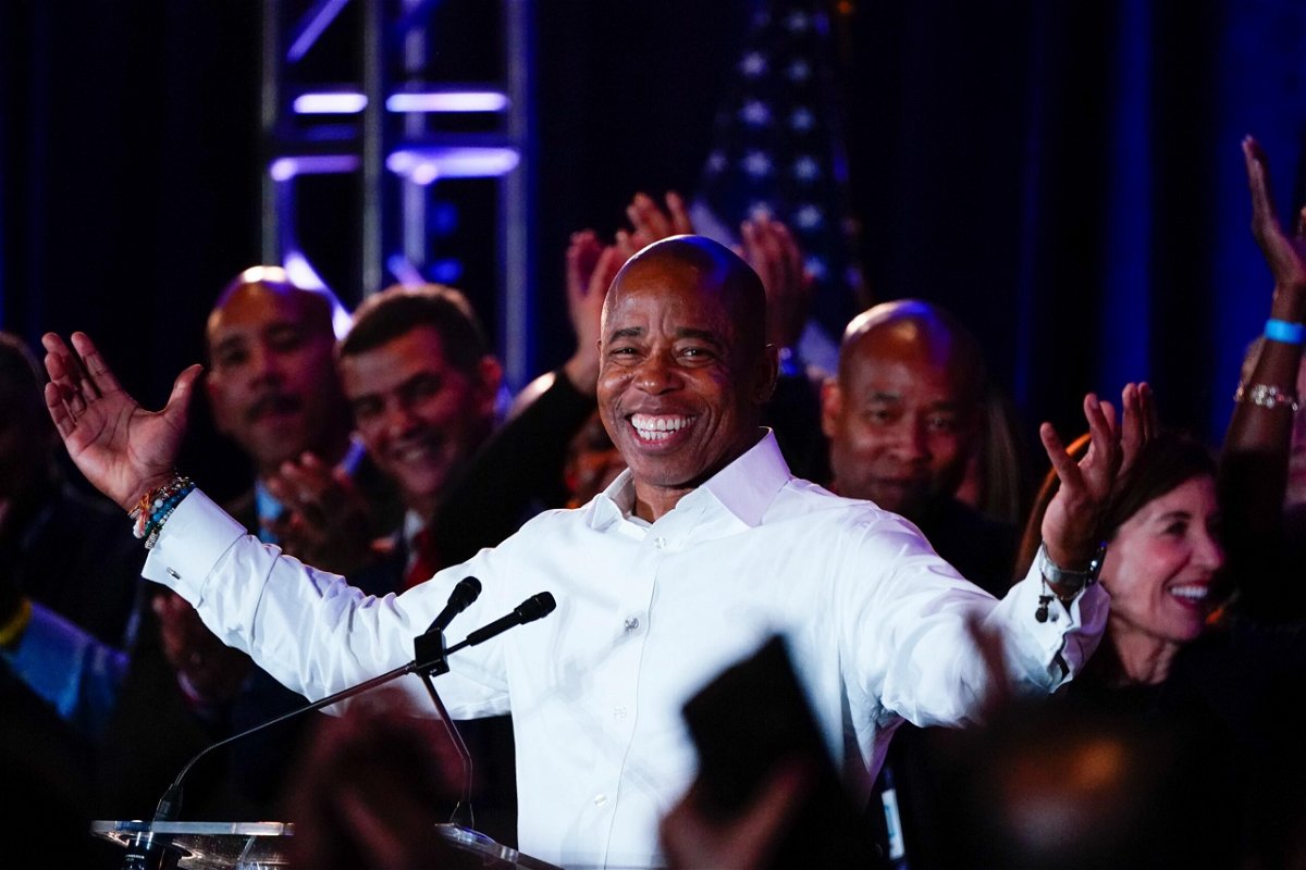 <i>Frank Franklin II/AP</i><br/>New York City Mayor-elect Eric Adams smiles at supporters late Tuesday