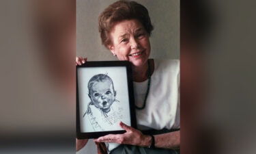 Ann Turner Cook holds a picture of the Gerber Baby sketch in a 1998 photo. Original Gerber Baby Ann Turner Cook