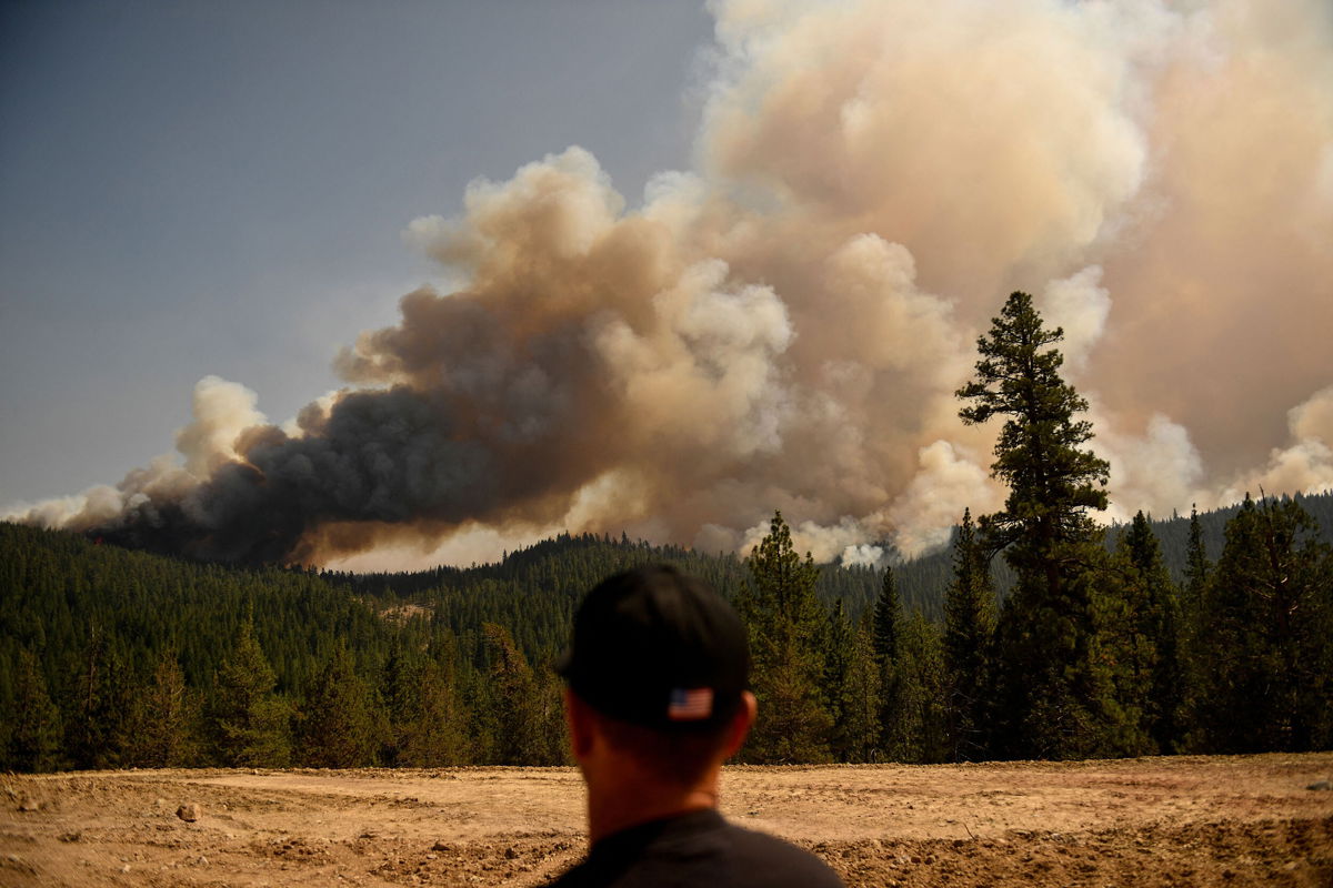 <i>Patrick T. Fallon/AFP/Getty Images</i><br/>there's a 19% to 26% jump in wildfire risk for each degree of summer temperature increase in the Sierra Nevada. Smoke plumes from the Dixie Fire on August 18