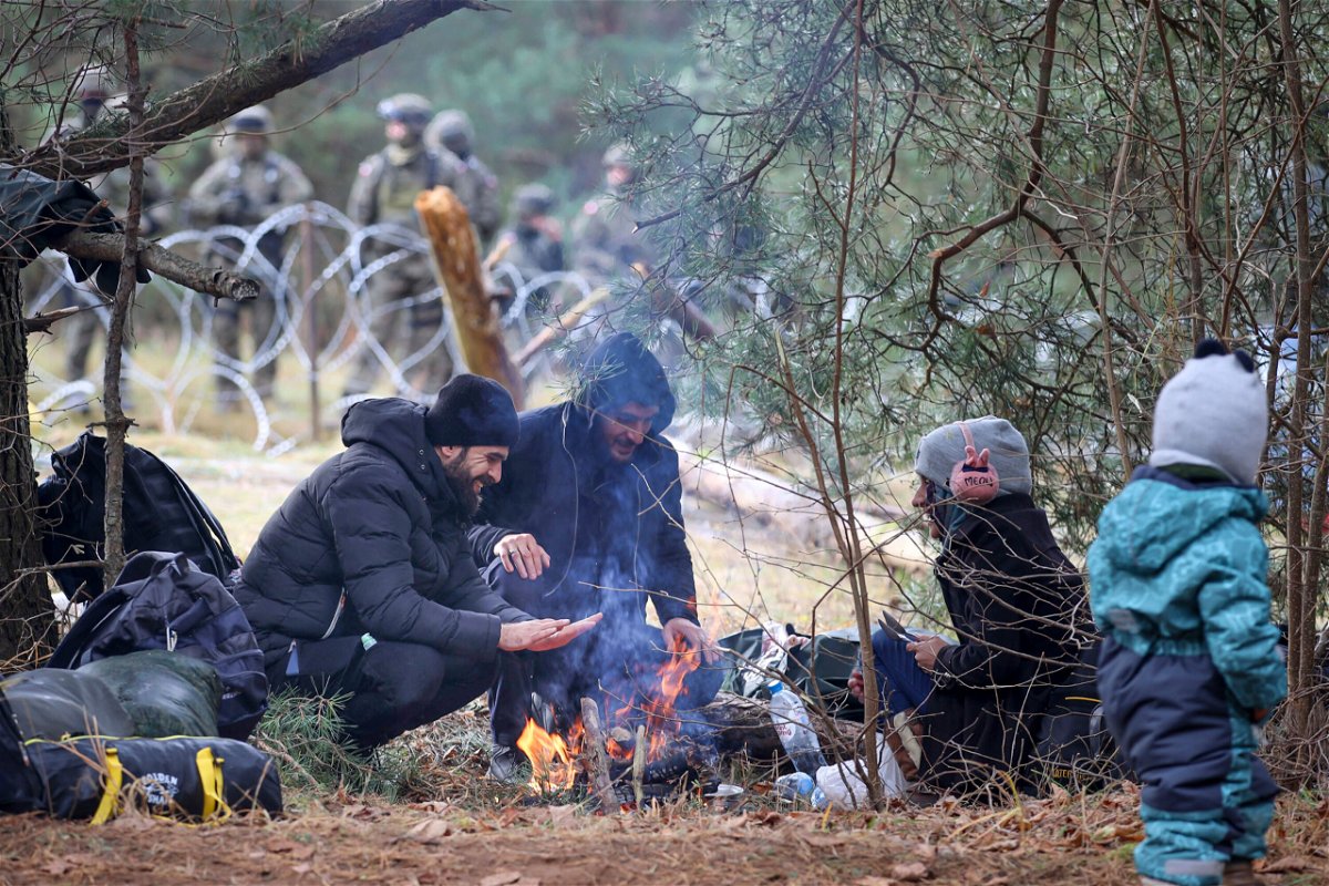 <i>Leonid Shcheglov/BelTA/AP</i><br/>Temperatures often plummet overnight leaving migrants camped in the freezing cold with little access to food and water.