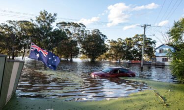 Australians are bracing for a wet and windy summer for a second year in a row as meteorologists said Tuesday that a La Niña weather event had formed in the Pacific Ocean. A car half submerged in a flood on March 24