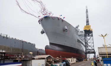 USNS Harvey Milk departs the General Dynamics NASSCO shipyard after a ceremonial address in San Diego