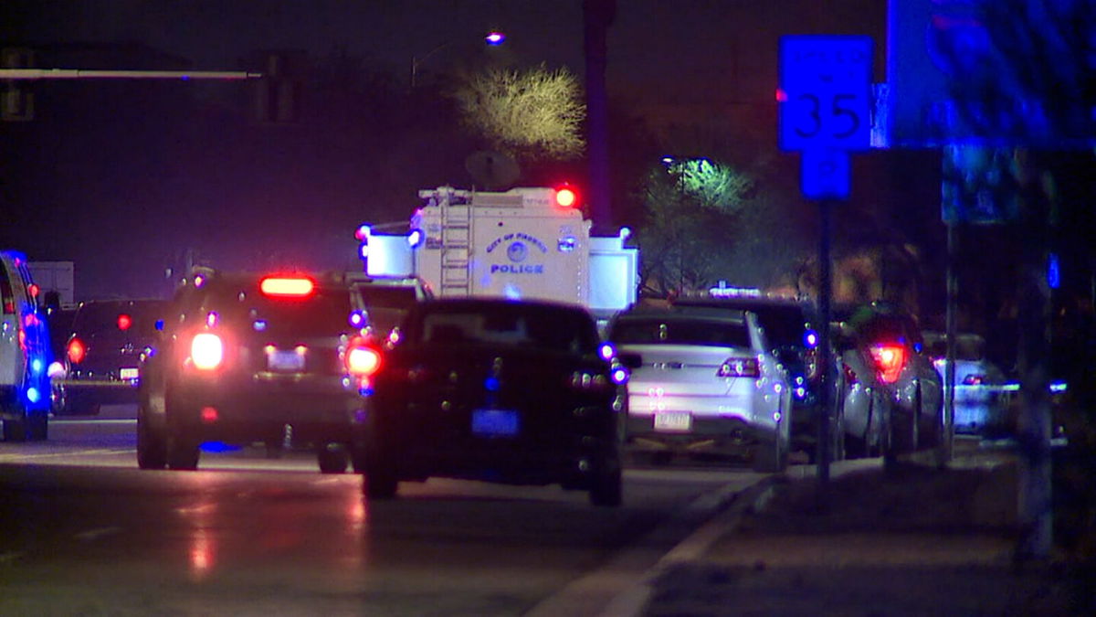 <i>KNXV</i><br/>Law enforcement vehicles near the scene of Friday's shooting outside Phoenix's main airport.