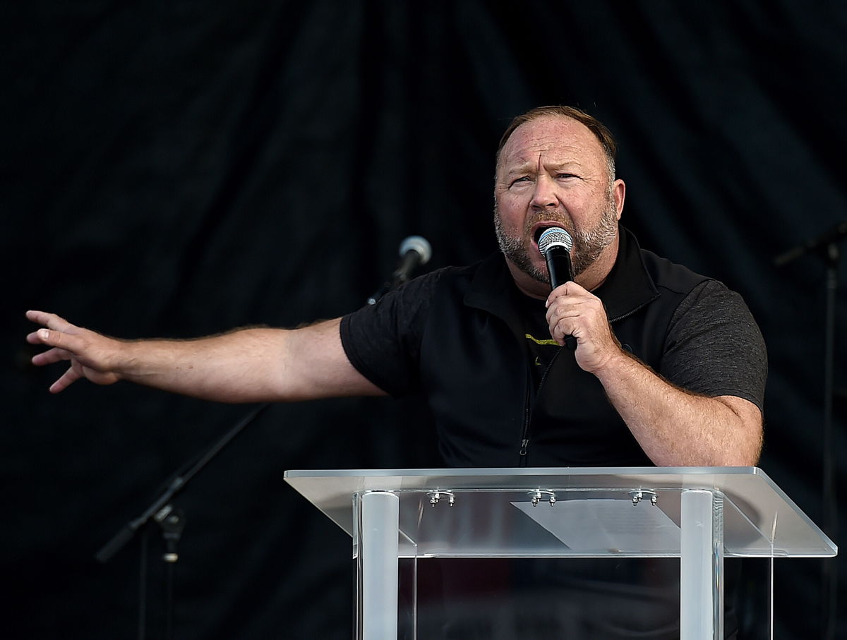<i>Olivier Douliery/AFP/Getty Images</i><br/>Sandy Hook families suing InfoWars founder Alex Jones have won a case against him after a judge ruled against Jones who has failed to comply with the discovery process. Jones is shown here speaking to supporters of US President Donald Trump as they demonstrate in Washington