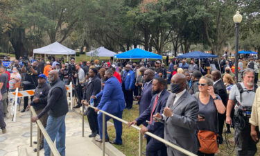 Dozens of Black pastors gather outside the Glynn County Courthouse during the Ahmaud Arbery death trial.