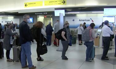 Flying is getting worse for both passengers and crews. People wait in line at an American Airlines counter at an airport in Charlotte