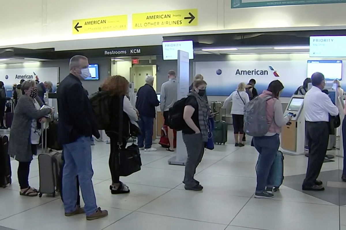 <i>AP</i><br/>Flying is getting worse for both passengers and crews. People wait in line at an American Airlines counter at an airport in Charlotte
