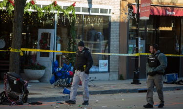 More than a dozen remain hospitalized after deadly Waukesha parade crash. Police are seen at the Christmas parade site on November 22