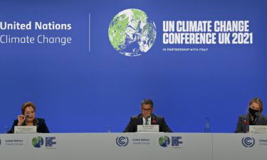 Britain's COP26 President Alok Sharma (C) and Executive secretary of the United Nations Framework Convention on Climate Change