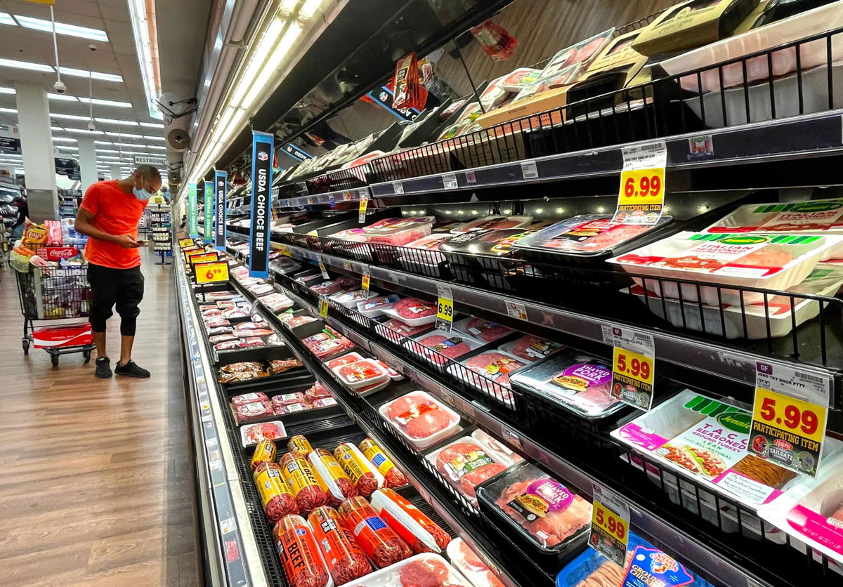 <i>Mario Tama/Getty Images</i><br/>A person shops in the meat section of a grocery store on November 11 in Los Angeles