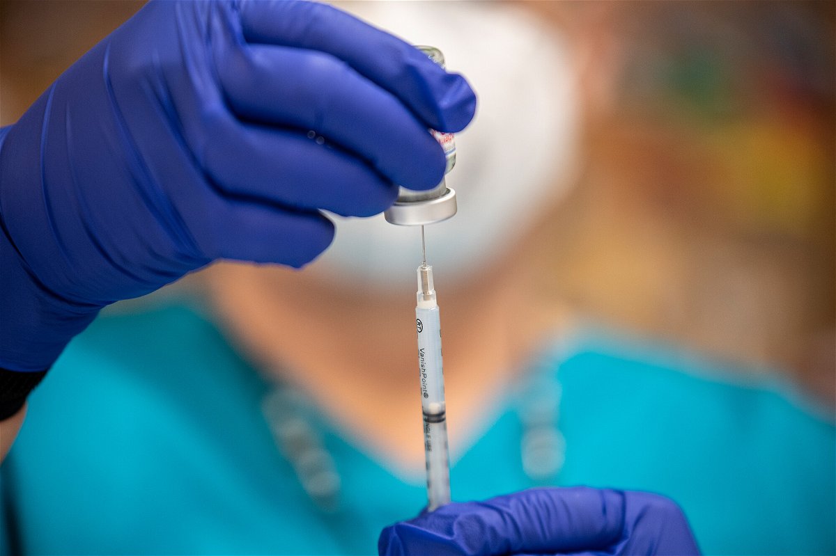 <i>Sergio Flores/Getty Images</i><br/>The Federal Register will publish within days the Labor Department's rule requiring private businesses with 100 or more employees to vaccinate them or test them weekly.