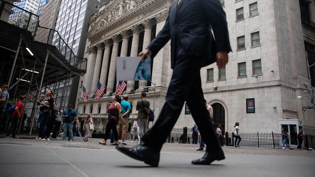 <i>Michael Nagle/Bloomberg/Getty Images</i><br/>Wall Street bankers are expected to get big increases in their bonus checks this year. Pedestrians pass in front of the New York Stock Exchange (NYSE) in New York