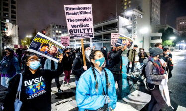 Demonstrators march through Oakland