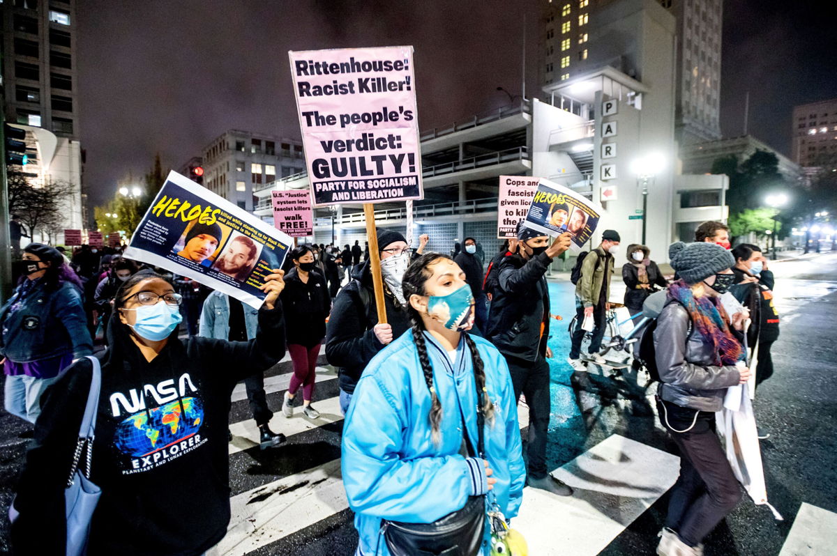 <i>Noah Berger/AP</i><br/>Demonstrators march through Oakland