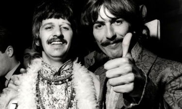 Ringo Starr and George Harrison of the Beatles doing a thumbs up at the 'All You Need Is Love' session at Abbey Road Studios