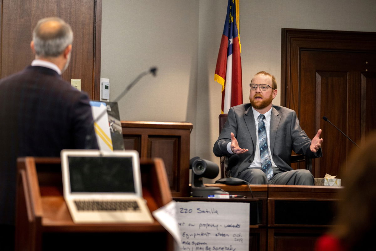 <i>Stephen B. Morton/Pool/AP</i><br/>Travis McMichael speaks from the witness stand during his trial Wednesday in Brunswick