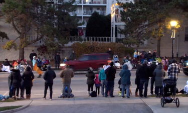 Video of the parade published on the city's Facebook page shows a red SUV driving quickly through the parade