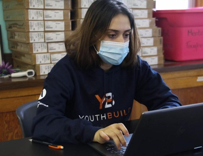 HOC YouthBuild student Evelyn, 16, of Sisters working on her education work in the YouthBuild classroom at Sisters