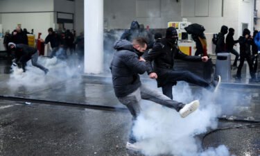 Protesters confront riot police during a demonstration against Covid-19 measures in Brussels
