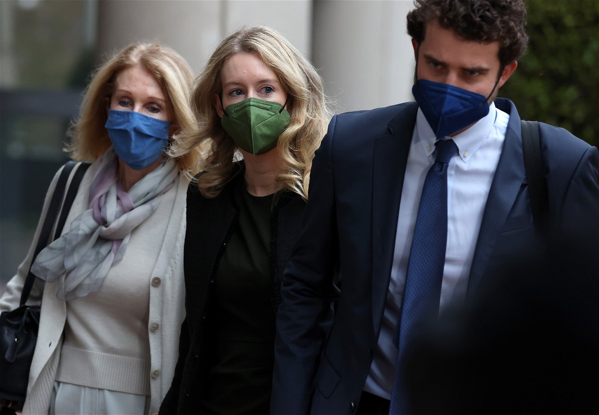 <i>Justin Sullivan/Getty Images</i><br/>Theranos founder and former CEO Elizabeth Holmes (C) walks with her mother Noel Holmes (L) and her partner Billy Evans (R) as they arrive for her trial on December 7.