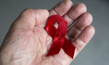 The Red Ribbon is a worldwide symbol of solidarity for people living with HIV and AIDS