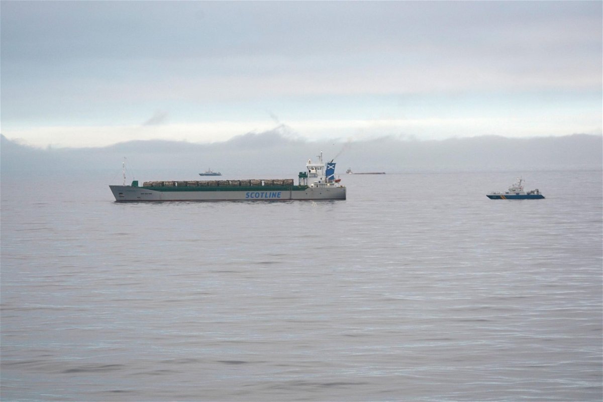 <i>Johan Nilsson/AFP/TT News Agency/Getty Images</i><br/>The Scot Carrier (left) and the capsized cargo ship Karin Hoej (center