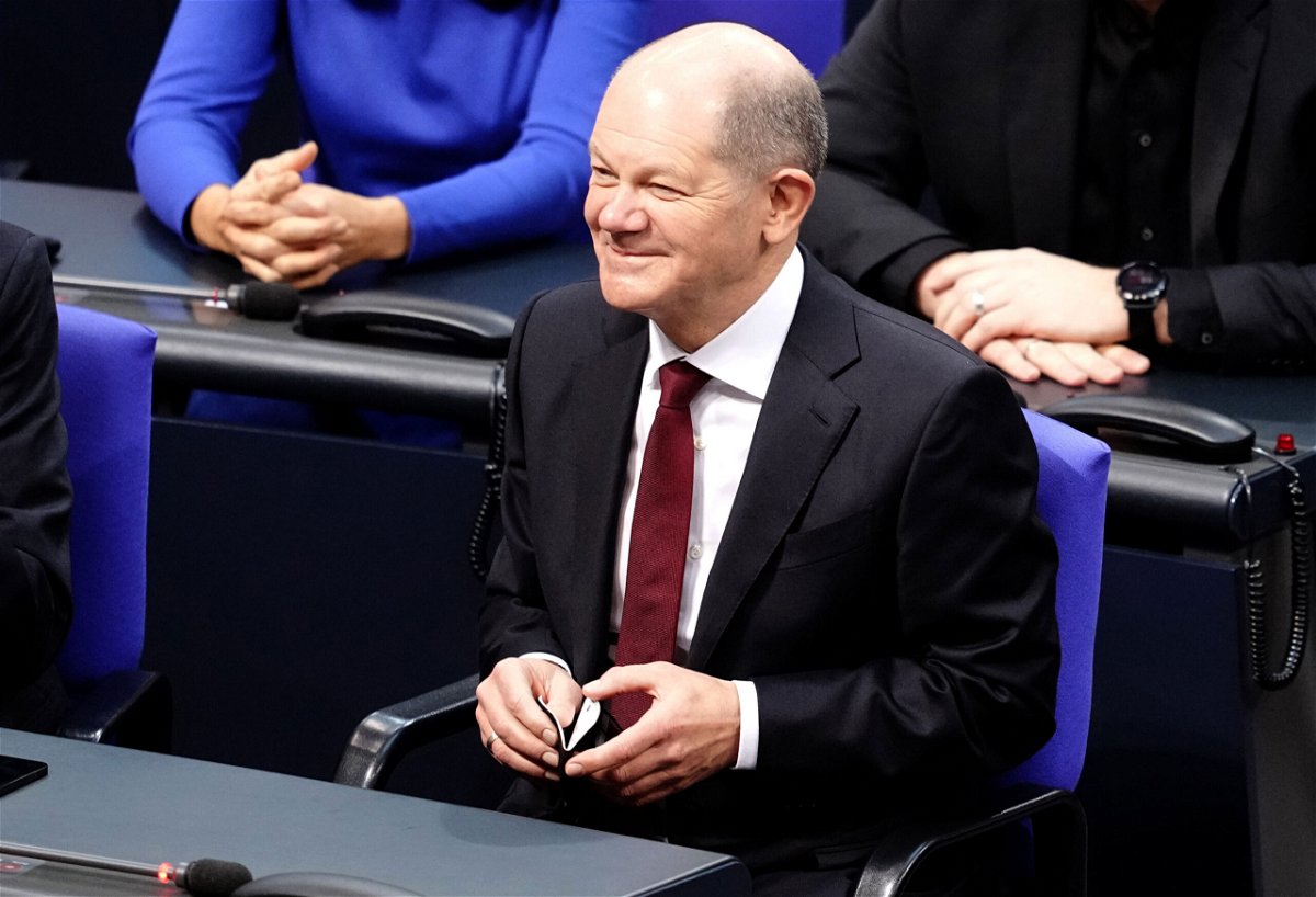 <i>Kay Nietfeld/picture alliance/Getty Images</i><br/>Olaf Scholz in the German Parliament after lawmakers voted him in as Chancellor.