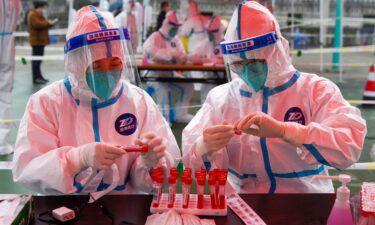 Medical workers prepare for nucleic acid test at a testing site in Zhenhai District of Ningbo City