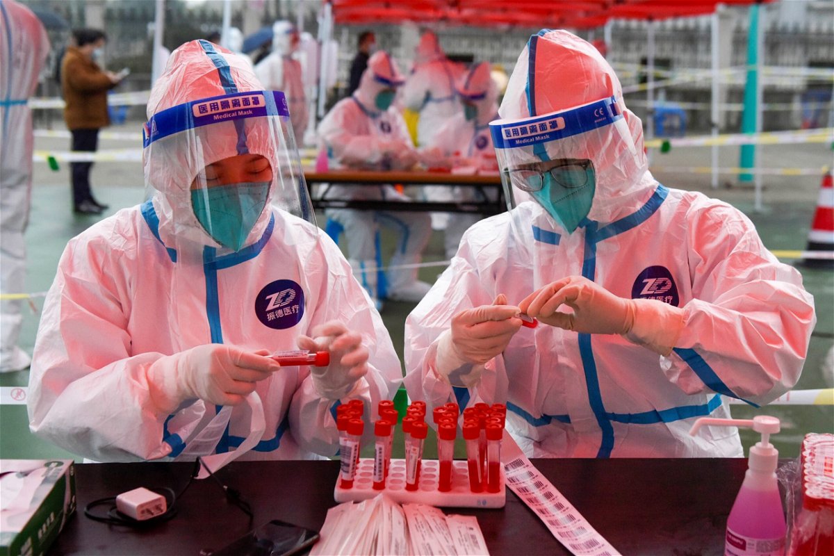 <i>Hu Xuejun/Xinhua/Getty Images</i><br/>Medical workers prepare for nucleic acid test at a testing site in Zhenhai District of Ningbo City