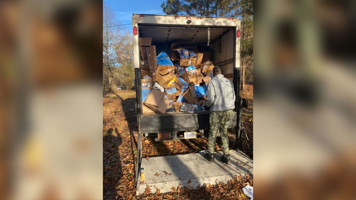 <i>Blount County Sheriff's Office</i><br/>Packages thrown into an Alabama ravine are loaded onto a truck on November 25.