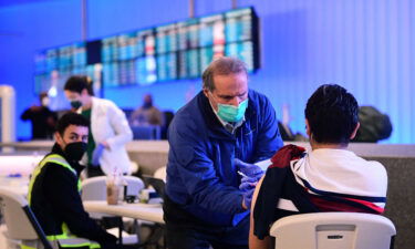 The Covid-19 vaccine is administered at a pop-up clinic at Los Angeles International Airport on December 22.