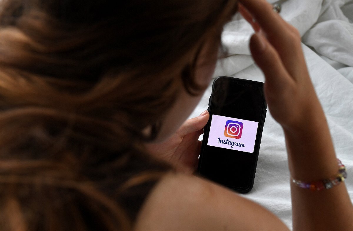 <i>Olivier Douliery/AFP/Getty Images</i><br/>A person looks at a smart phone with a Instagram logo displayed on the screen